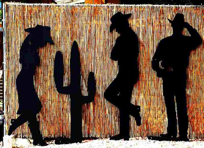 leaning cowboy cowgirl silhouette cactus lifesize  silhouettes